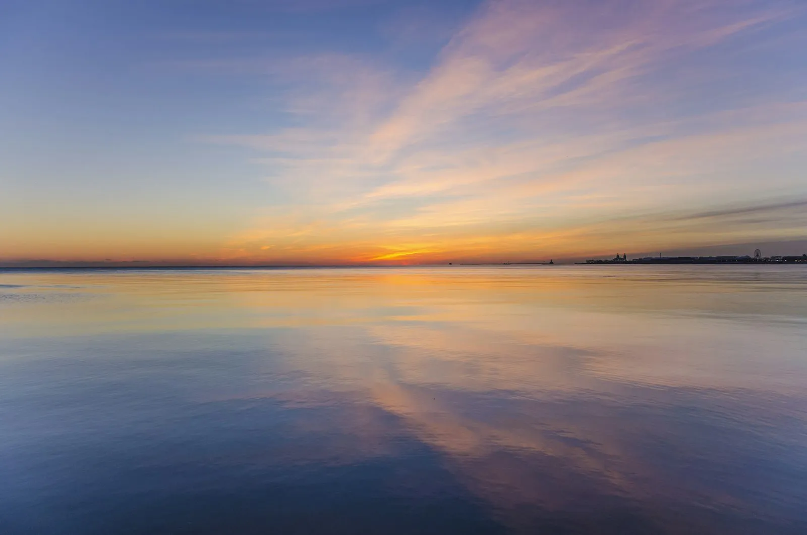 Calm water under a soft sky Calm water under a soft sky