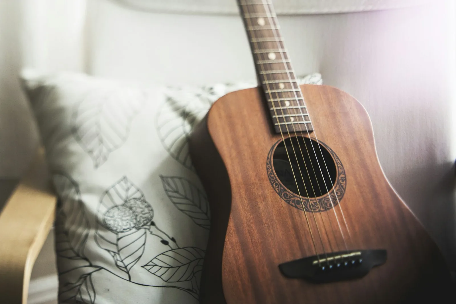 An acoustic guitar resting in a calm therapy space at The Trinity, Fort Worth Texas