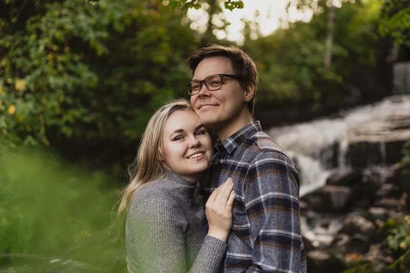 A couple holding each other and smiling A couple holding each other and smiling